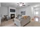 Inviting living room with a cozy fireplace, neutral tones, and ample seating at 2735 Maple Park Pl # 32, Cumming, GA 30041