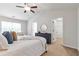Spacious main bedroom featuring a ceiling fan, with an ensuite bathroom and walk-in closet at 2735 Maple Park Pl # 32, Cumming, GA 30041
