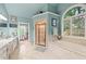 Bathroom boasts tiled floors, double vanity, soaking tub under a window, and glass enclosed shower at 321 River Green Ave, Canton, GA 30114