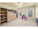 Versatile spare bedroom with built-in storage and lots of natural light from the two bright windows at 321 River Green Ave, Canton, GA 30114