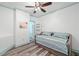 Small bedroom with wooden floor, daybed, and light blue walls at 321 River Green Ave, Canton, GA 30114