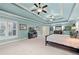 Spacious bedroom featuring a tray ceiling, plantation shutters, and neutral carpet at 321 River Green Ave, Canton, GA 30114