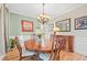 Elegant dining room with a hardwood floors, large table, and stylish decor at 321 River Green Ave, Canton, GA 30114