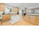 Spacious kitchen with custom wood cabinets, granite counters, and a large center island at 321 River Green Ave, Canton, GA 30114