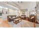 Bright living room featuring a 2 story ceiling, hardwood floors, and comfortable furniture at 321 River Green Ave, Canton, GA 30114