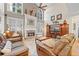 Bright living room with vaulted ceilings, fireplace, and comfortable seating at 321 River Green Ave, Canton, GA 30114