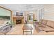 Inviting living room with a fireplace, wood-look floors, and ample seating at 321 River Green Ave, Canton, GA 30114