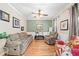 Cozy living room with hardwood floors, neutral paint, and comfortable seating at 321 River Green Ave, Canton, GA 30114