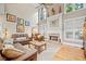Inviting living room with vaulted ceilings, a cozy fireplace, plush seating, and large windows at 321 River Green Ave, Canton, GA 30114
