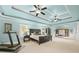 Large bedroom with tray ceilings, columns, sitting area, and large bed at 321 River Green Ave, Canton, GA 30114