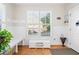 Mud Room with hardwood floors, white bench, hooks, and view of the street out of the window at 321 River Green Ave, Canton, GA 30114