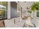 Inviting front porch with comfortable seating and decorative ferns, perfect for relaxing at 321 River Green Ave, Canton, GA 30114