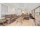 Relaxing sunroom with bright light, comfortable furniture, and a ceiling fan at 321 River Green Ave, Canton, GA 30114