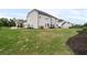 The backyard features a lush lawn and mature trees at 6840 Canyon Creek Way, Cumming, GA 30028