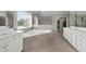 Bright bathroom boasting double vanities, a large soaking tub and stylish tiling at 6840 Canyon Creek Way, Cumming, GA 30028