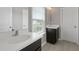 Stylish bathroom featuring double sink vanity, modern fixtures and well-lit mirror at 6840 Canyon Creek Way, Cumming, GA 30028