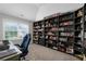 This bedroom features a built-in bookcase and a large window letting in plenty of natural light at 6840 Canyon Creek Way, Cumming, GA 30028