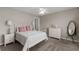 Cozy bedroom featuring neutral walls, ceiling fan, and coordinated furniture set at 6840 Canyon Creek Way, Cumming, GA 30028