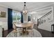 Charming dining area with dark wood floors and natural light at 6840 Canyon Creek Way, Cumming, GA 30028