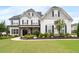Charming two-story home with a well-manicured lawn and inviting curb appeal at 6840 Canyon Creek Way, Cumming, GA 30028