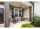Cozy front porch features rocking chairs and stone accents at 6840 Canyon Creek Way, Cumming, GA 30028