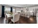 Bright eat-in kitchen with stainless steel appliances, a large island, and dark accents at 6840 Canyon Creek Way, Cumming, GA 30028