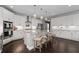 Spacious kitchen with stainless appliances, white cabinetry, and oversized island at 6840 Canyon Creek Way, Cumming, GA 30028