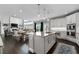 Open concept kitchen with a large island, connecting to the dining and living spaces at 6840 Canyon Creek Way, Cumming, GA 30028