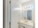Bathroom featuring single sink vanity, large mirror, and bright lighting at 3120 Westwood Dr, Acworth, GA 30102