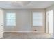 Bedroom featuring neutral carpet, two bright windows and ensuite bathroom at 3120 Westwood Dr, Acworth, GA 30102