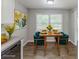 Staged dining area with a large window, table, and artwork at 3120 Westwood Dr, Acworth, GA 30102