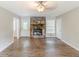 Open-concept living room with a stone fireplace and wood-look floors at 3120 Westwood Dr, Acworth, GA 30102