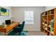 Bright office space with built-in shelving and a stylish desk setup at 3120 Westwood Dr, Acworth, GA 30102