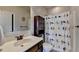 Bathroom featuring a vanity and a shower with a bird-themed curtain at 7470 Oldbury Pl, Cumming, GA 30040