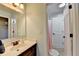 Clean bathroom featuring a white sink vanity, large mirror, and a white shower at 7470 Oldbury Pl, Cumming, GA 30040