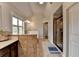 This bathroom features a double sink vanity, tiled shower and tile floors at 7470 Oldbury Pl, Cumming, GA 30040