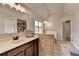 This bathroom features a double sink vanity, tile floor and separate shower at 7470 Oldbury Pl, Cumming, GA 30040
