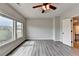 Bright bedroom with windows offering natural light and wood-look flooring at 7470 Oldbury Pl, Cumming, GA 30040