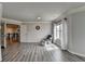 Comfortable bonus room with ample space, natural light and wood-look floors at 7470 Oldbury Pl, Cumming, GA 30040