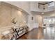 Grand foyer with high ceilings, decorative wallpaper, dark hardwood floors, and elegant wainscoting at 7470 Oldbury Pl, Cumming, GA 30040