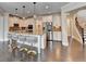 Modern kitchen featuring a large island, stainless steel appliances, and ample counter space at 7470 Oldbury Pl, Cumming, GA 30040