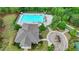 Aerial view of the pool area showing the pool, lounge chairs, playground, green space, landscaping and the pool house at 7470 Oldbury Pl, Cumming, GA 30040