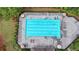 Overhead view of the community swimming pool with multiple lounge chairs and a few people swimming in the water at 7470 Oldbury Pl, Cumming, GA 30040