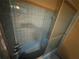 This bathroom features a blue tiled shower with sliding glass doors at 1856 Butler Bridge Rd, Covington, GA 30016