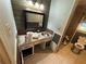 Unique bathroom with wood paneling, a sink, and toilet at 1856 Butler Bridge Rd, Covington, GA 30016