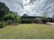 Cozy single-story brick home with mature landscaping, front porch, and ample yard space at 1856 Butler Bridge Rd, Covington, GA 30016