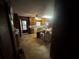 Traditional eat-in kitchen with wood cabinets, laminate floors, and a door leading to the backyard at 1856 Butler Bridge Rd, Covington, GA 30016