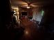Hardwood floors, ceiling fan, and open access to other rooms highlight this large living room at 1856 Butler Bridge Rd, Covington, GA 30016