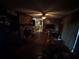 Spacious living room with hardwood floors, brick fireplace, ceiling fan, and access to multiple rooms at 1856 Butler Bridge Rd, Covington, GA 30016
