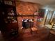Close-up of the brick fireplace and hardwood floors in the spacious living room at 1856 Butler Bridge Rd, Covington, GA 30016